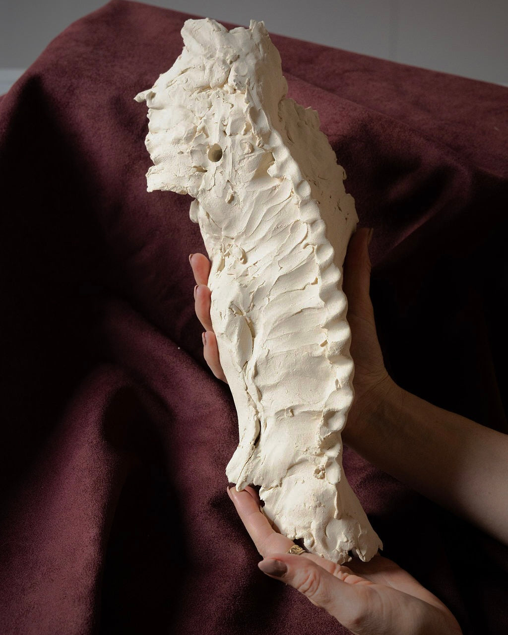 Unglazed Female Form Wall Sculpture with Crest