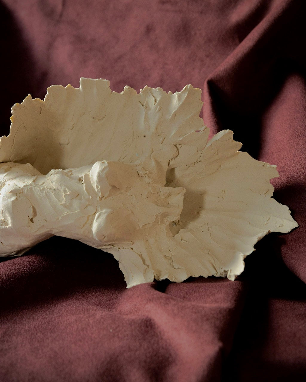 Unglazed Female Form Wall Sculpture with Crest